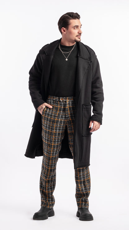 Pantalon noir et jaune en tissu bouclé Unik Paris coupe droite